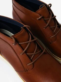 Cole Haan Men's ØriginalGrand Chukka Boot -Standrews Links Officials Store C28213xWOODBERRYLEATHERIVORYxAlt2 78008702
